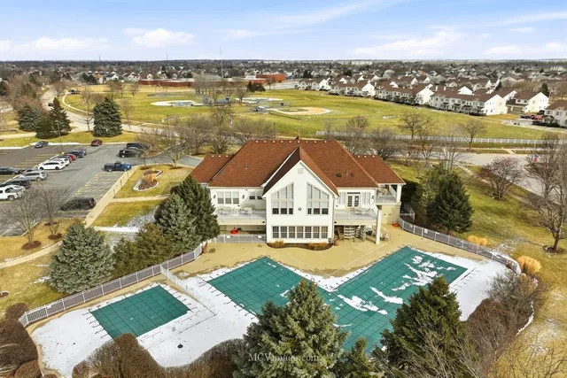 an aerial view of a house with a ocean view