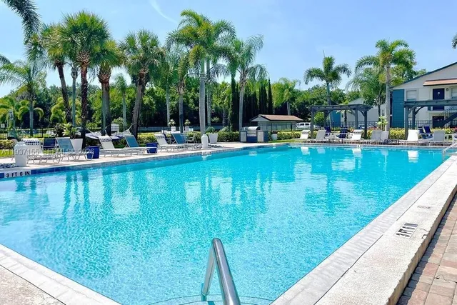 a view of swimming pool with chairs