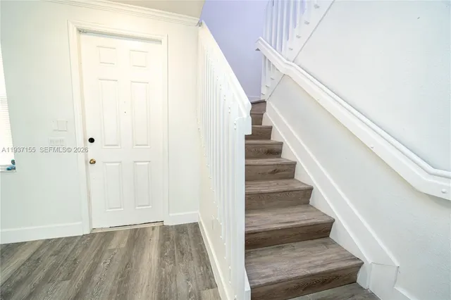 a view of staircase with white walls and white walls