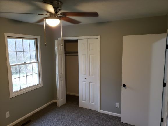 27 Sloan Branch Road Pleasant Shade, TN 37145 - Photo 17 of 35 an empty room with windows and fan