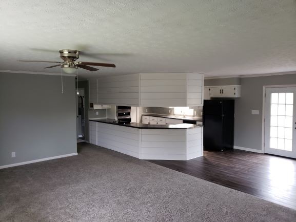 27 Sloan Branch Road Pleasant Shade, TN 37145 - Photo 5 of 35 a kitchen with stainless steel appliances a refrigerator and a stove