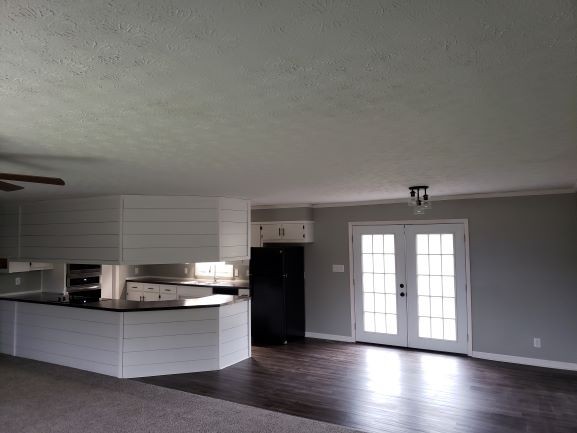 27 Sloan Branch Road Pleasant Shade, TN 37145 - Photo 6 of 35 a kitchen with stainless steel appliances granite countertop a stove and a refrigerator