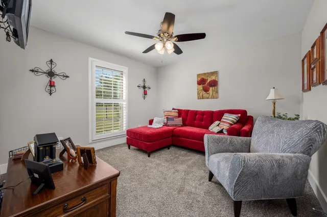 a living room with furniture and a window