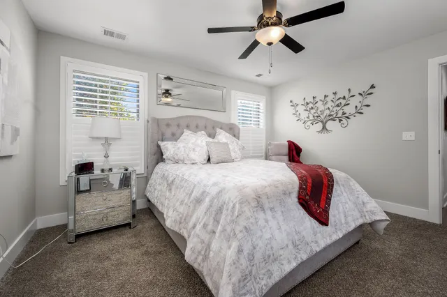 a bedroom with a bed and window