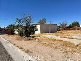 a view of a house with a yard covered in snow
