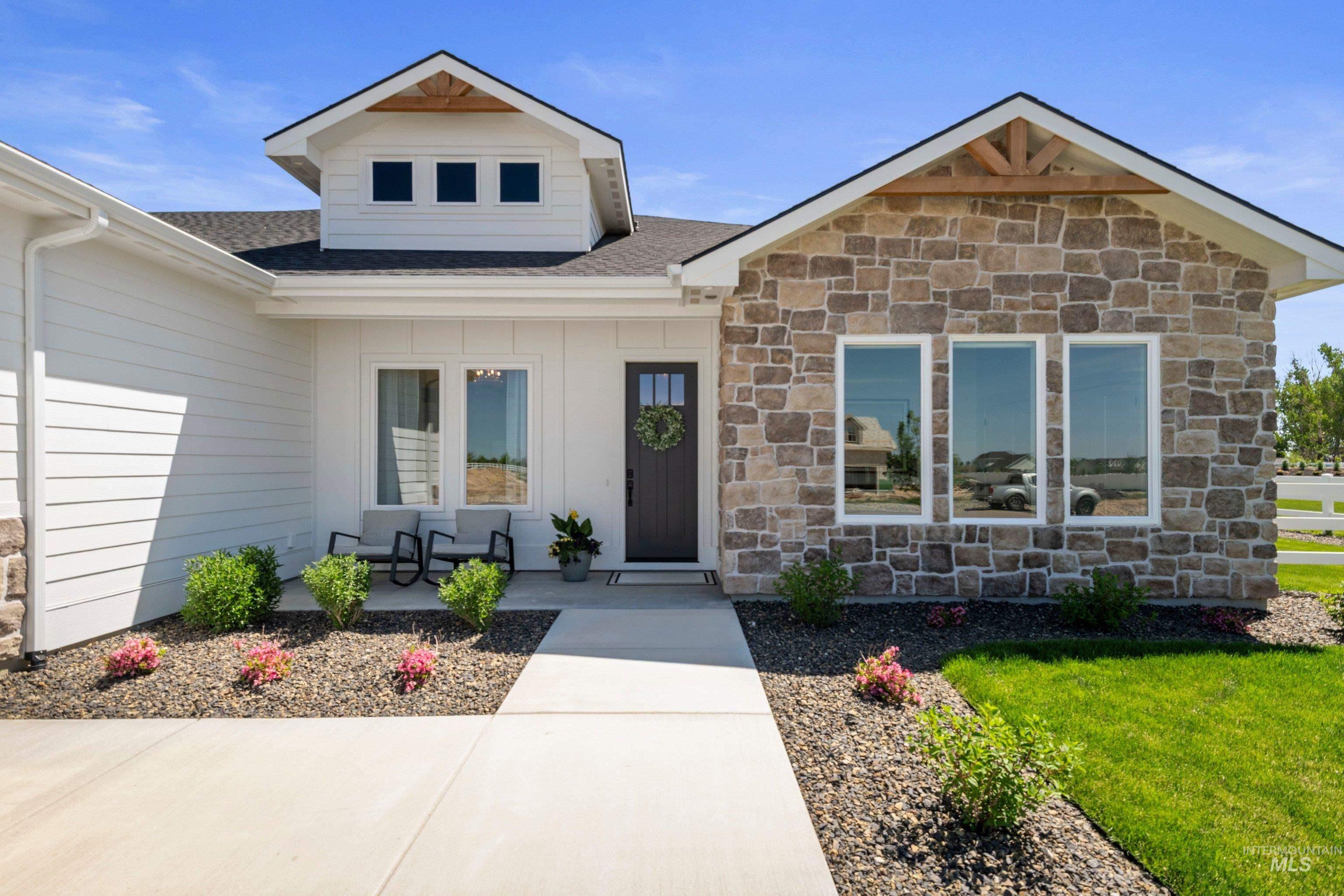 24990 Belgian Way Middleton, ID 83644 - Photo 8 of 50 Contemporary exterior featuring white siding and natural stone accents