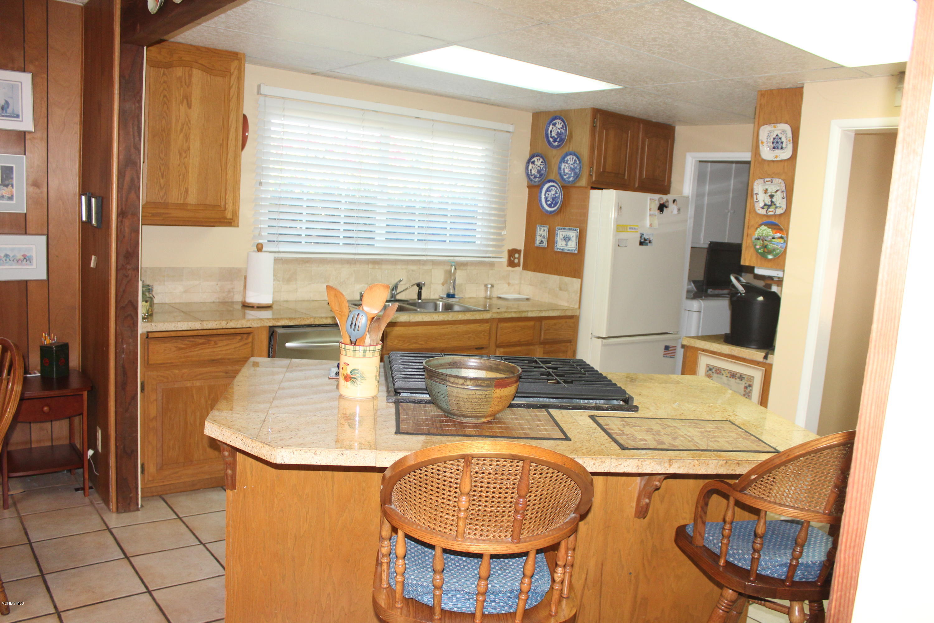 1219 West Roderick Avenue Oxnard, CA 93030 - Photo 2 of 15 a dining table with chairs and window