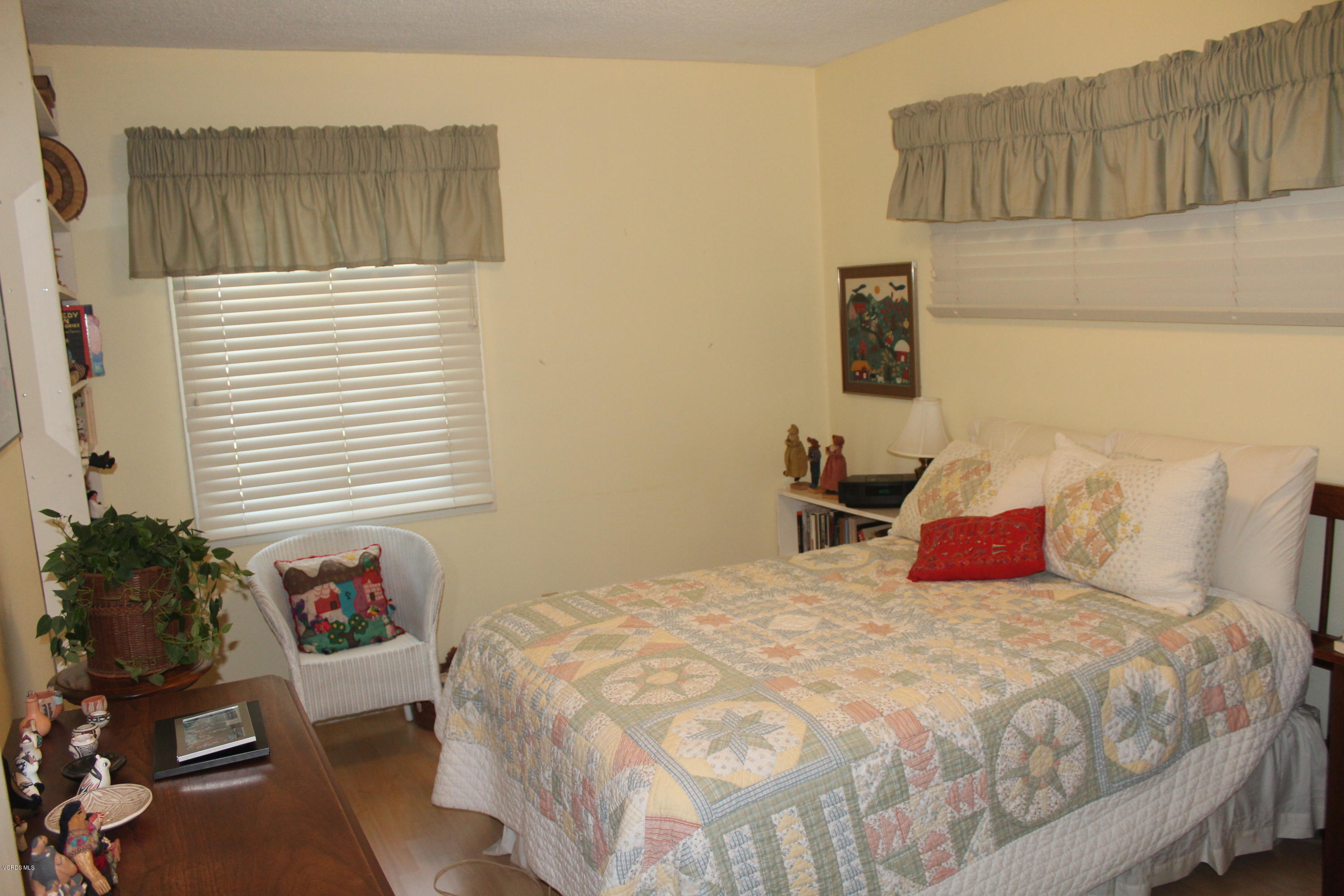 1219 West Roderick Avenue Oxnard, CA 93030 - Photo 11 of 15 a bedroom with a bed and a window