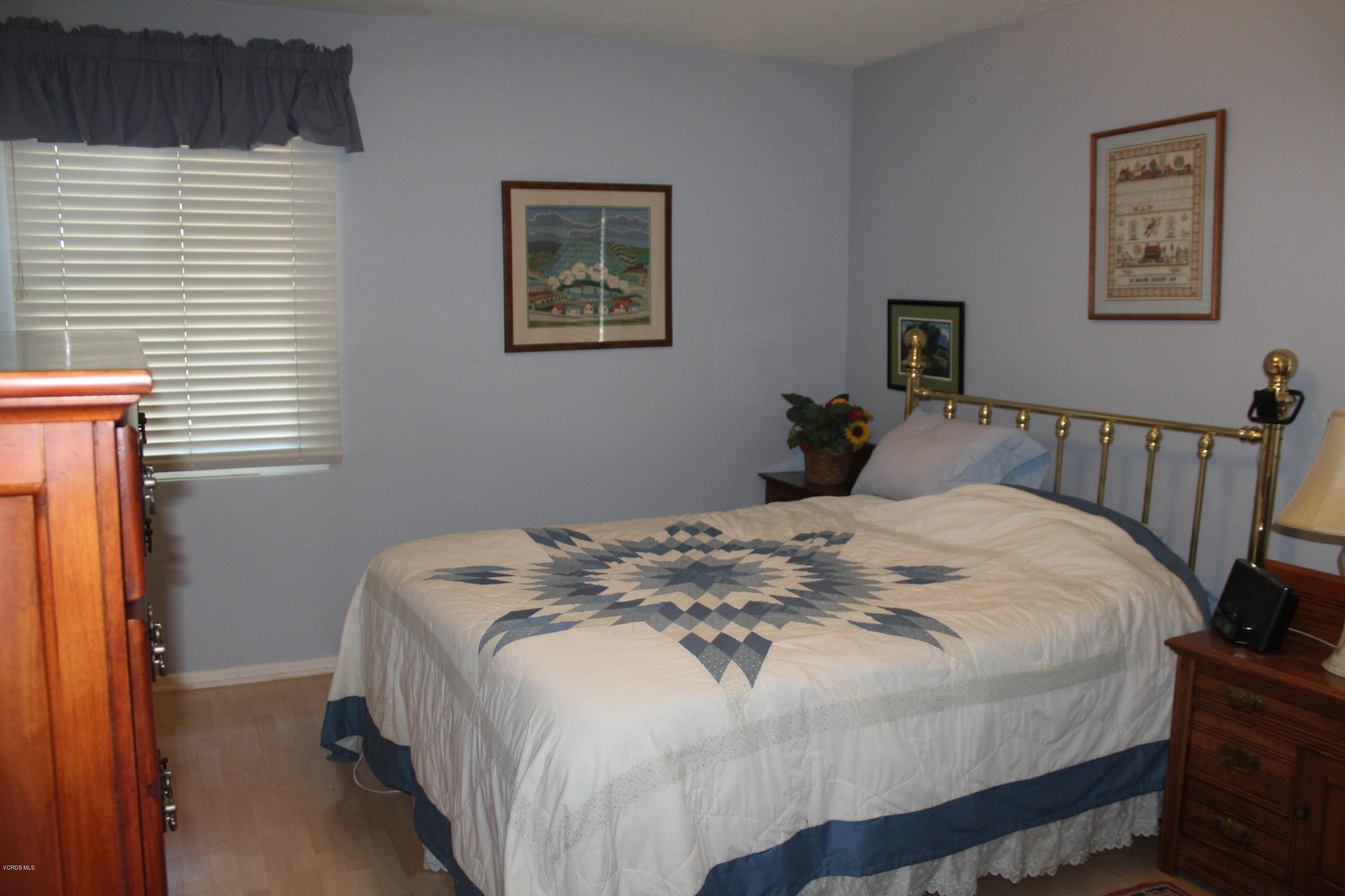 1219 West Roderick Avenue Oxnard, CA 93030 - Photo 10 of 15 a bedroom with a bed and a window