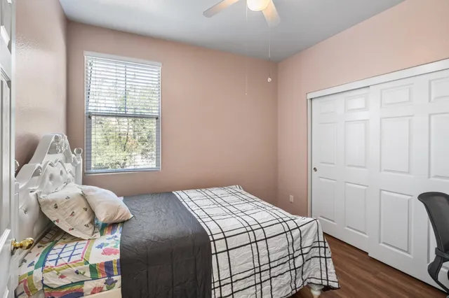 a bedroom with a bed and a window