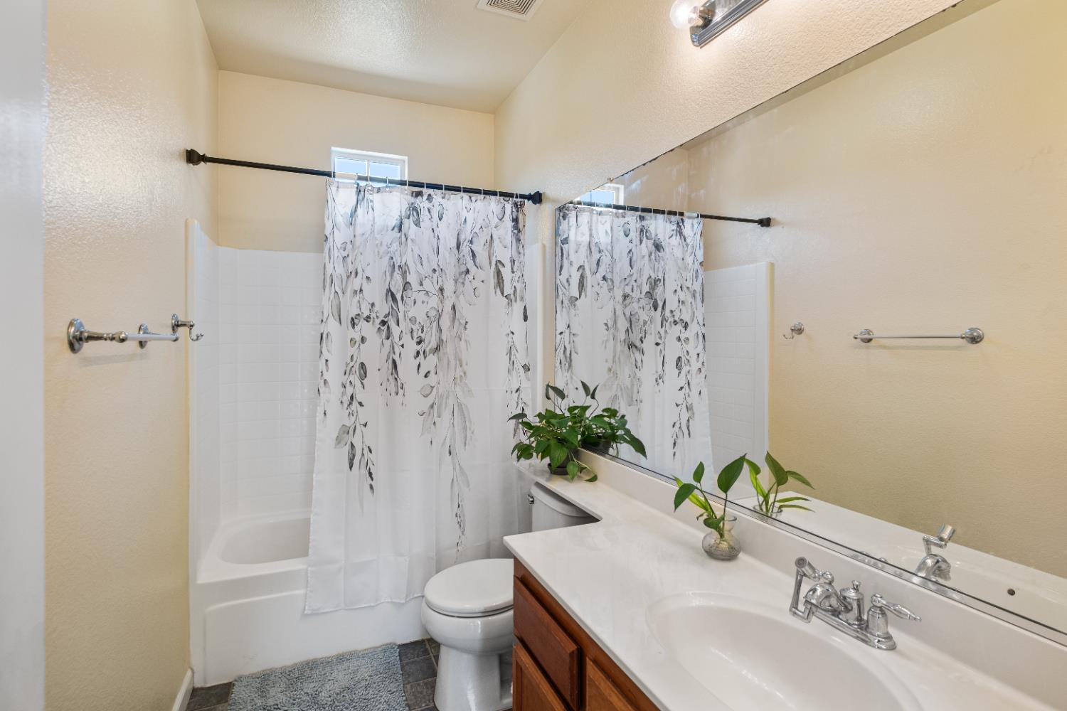 692 Humbert Street Folsom, CA 95630 - Photo 15 of 28 a bathroom with a granite countertop sink toilet and shower
