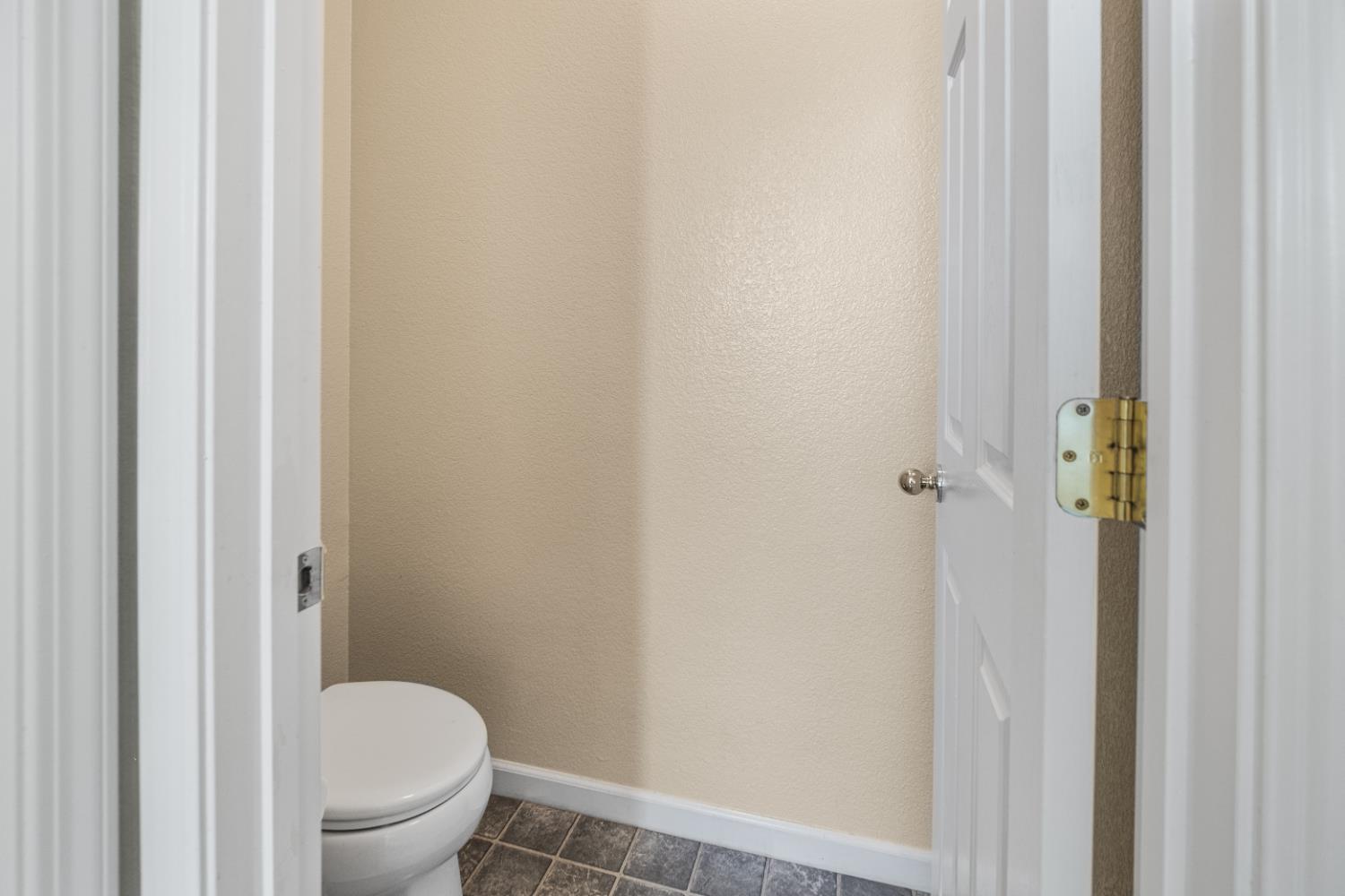 692 Humbert Street Folsom, CA 95630 - Photo 20 of 28 a white toilet sitting next to a shower