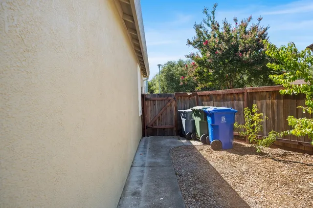 a backyard of a house with yard and outdoor seating