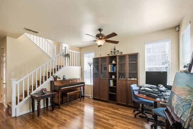 a living room with furniture and a window