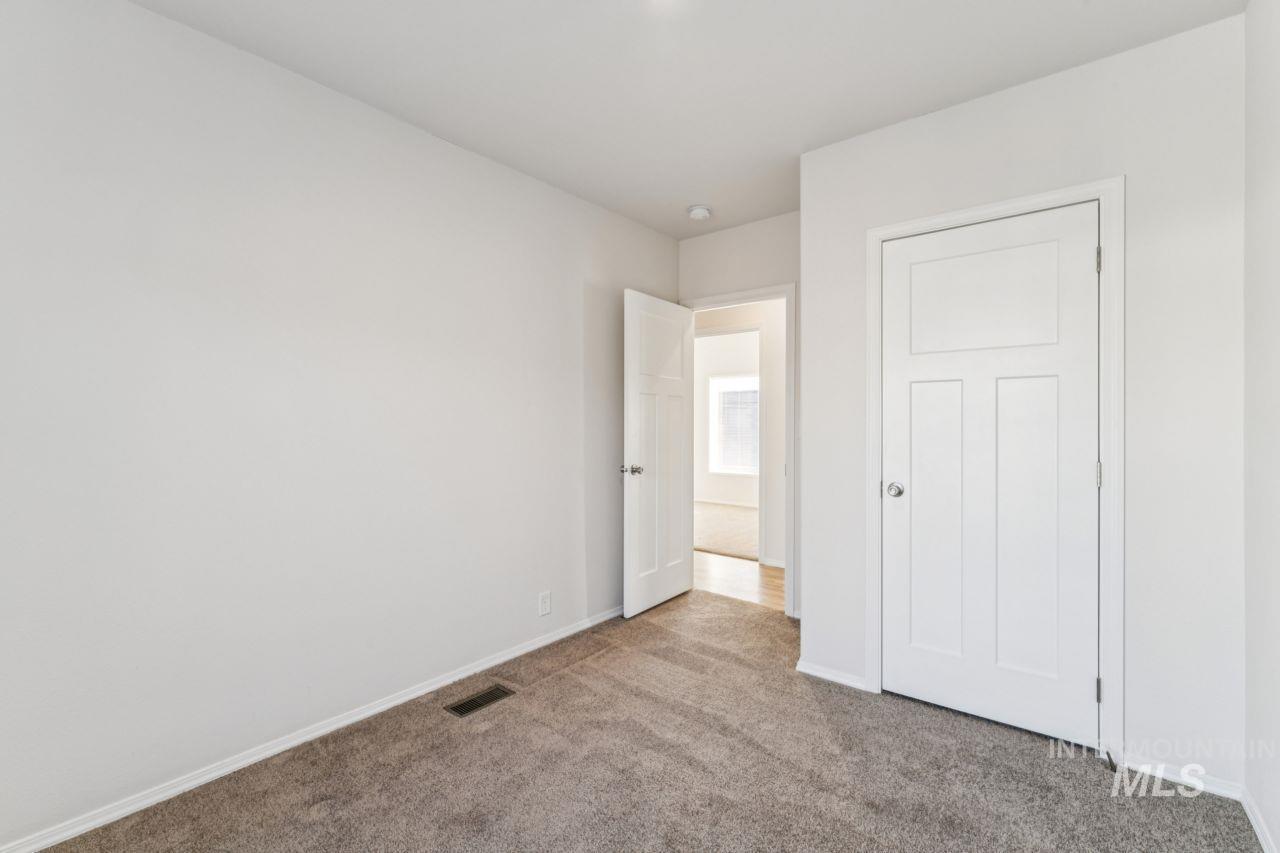 2750 Alden Road, Unit 2 Fruitland, ID 83619 - Photo 12 of 24 Unfurnished bedroom featuring carpet flooring and baseboards