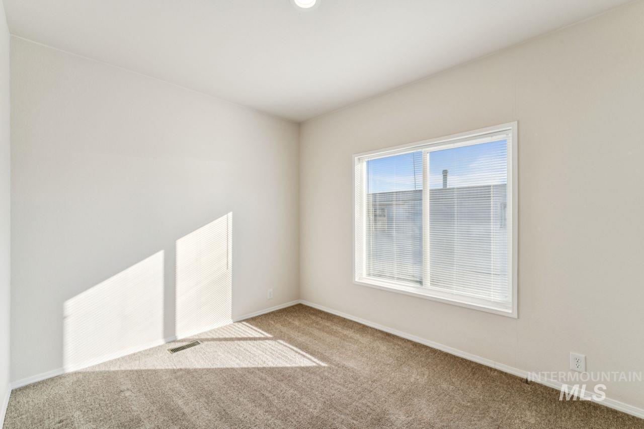 2750 Alden Road, Unit 2 Fruitland, ID 83619 - Photo 16 of 24 Unfurnished room featuring carpet floors and baseboards
