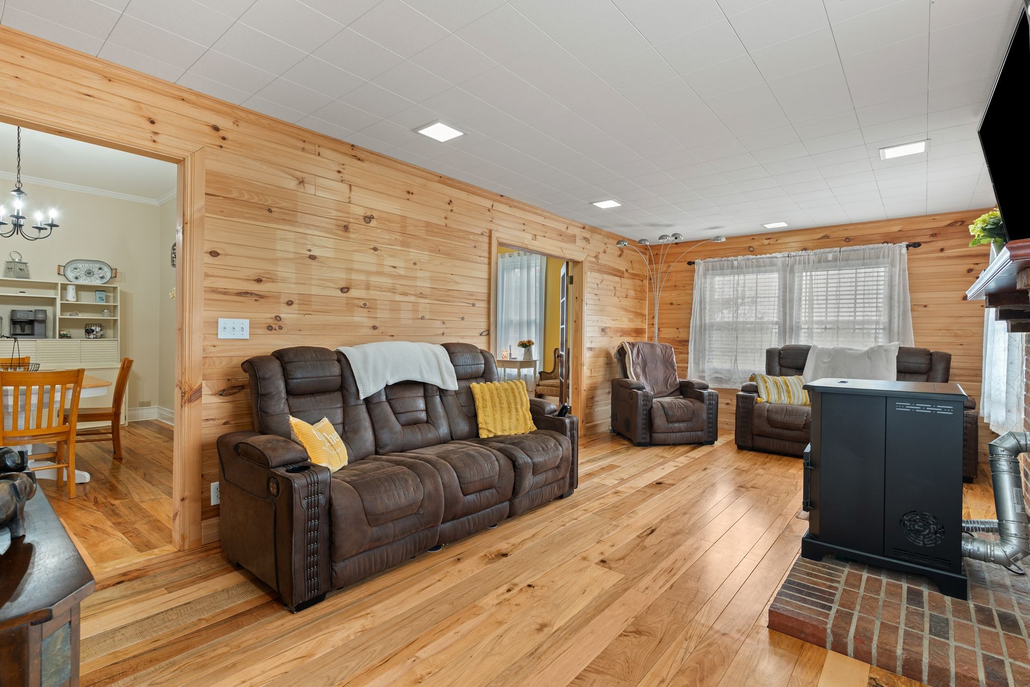 5867 Borthick Road Springfield, TN 37172 - Photo 11 of 43 a living room with furniture fireplace and a flat screen tv