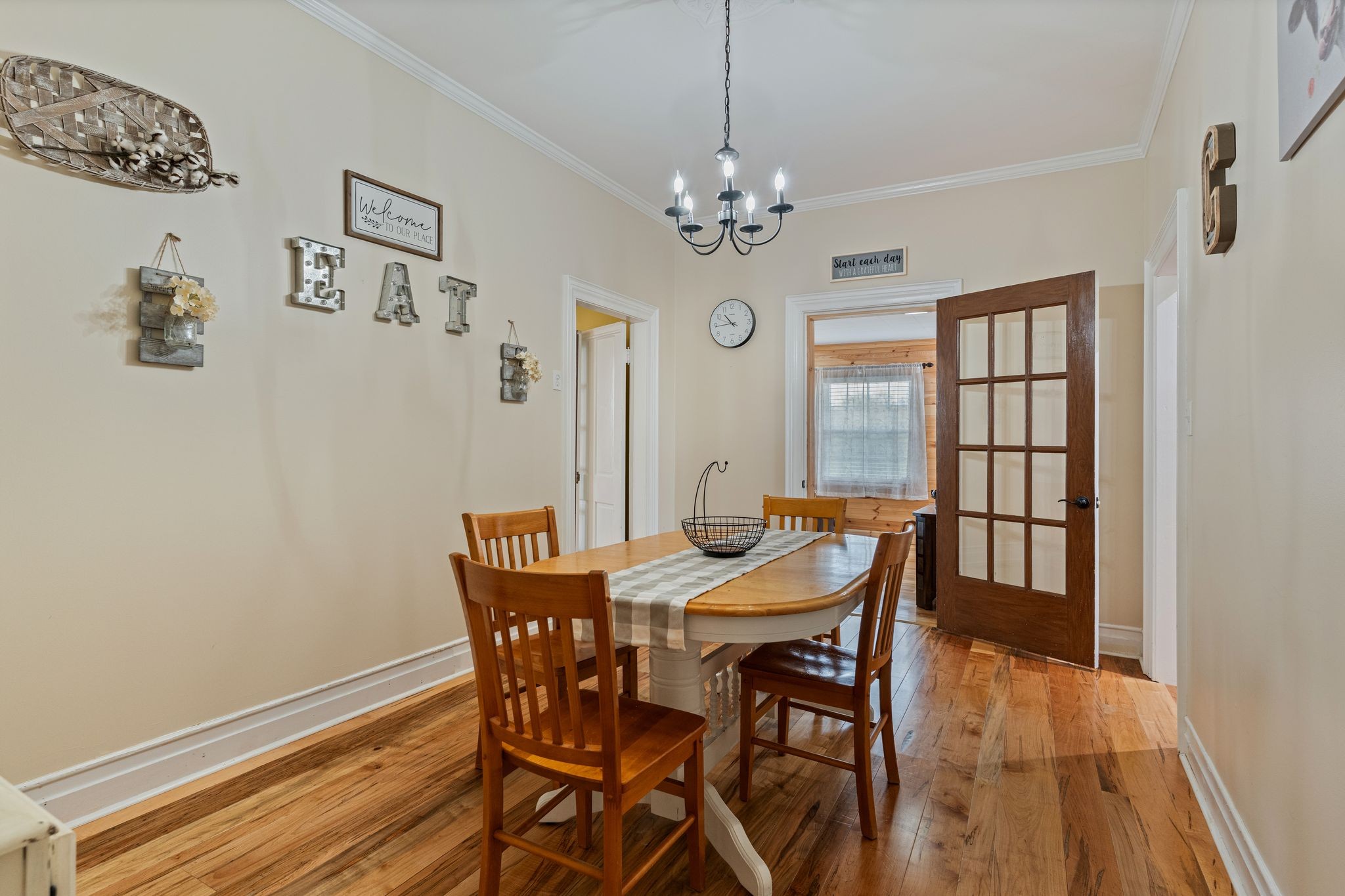 5867 Borthick Road Springfield, TN 37172 - Photo 13 of 43 a view of a dining room with furniture a chandelier and wooden floor
