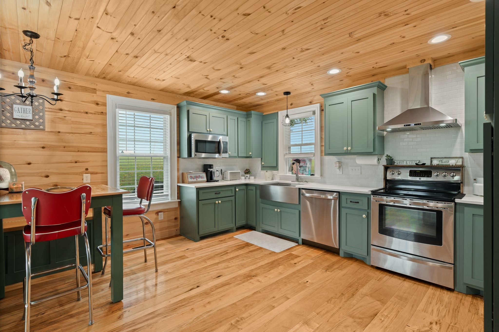 5867 Borthick Road Springfield, TN 37172 - Photo 14 of 43 a kitchen with stainless steel appliances kitchen island granite countertop a stove a sink and a refrigerator