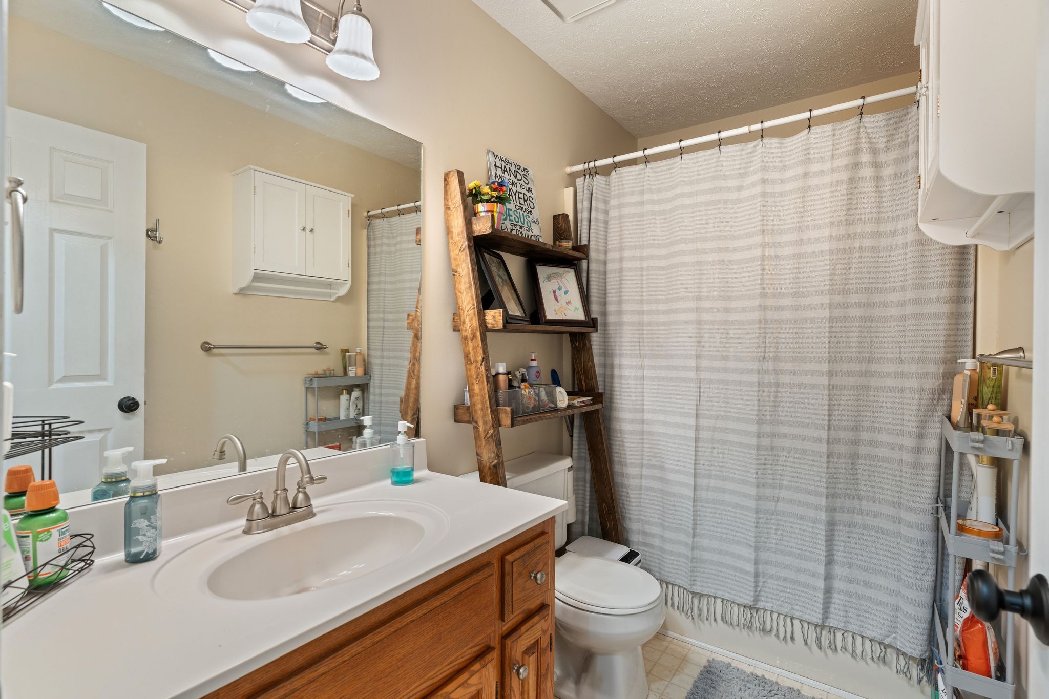 5867 Borthick Road Springfield, TN 37172 - Photo 21 of 43 a bathroom with a sink toilet and shower