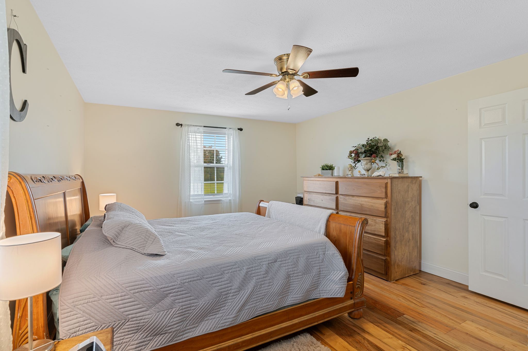 5867 Borthick Road Springfield, TN 37172 - Photo 24 of 43 a bedroom with a bed and wooden floor