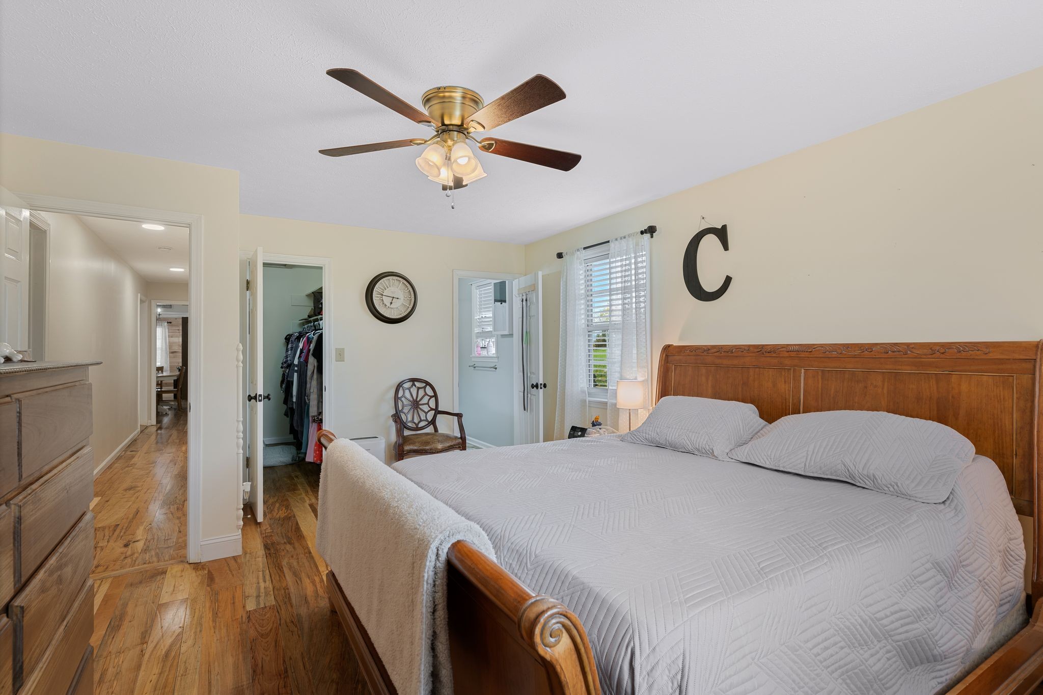 5867 Borthick Road Springfield, TN 37172 - Photo 25 of 43 a bedroom with a bed and a chandelier