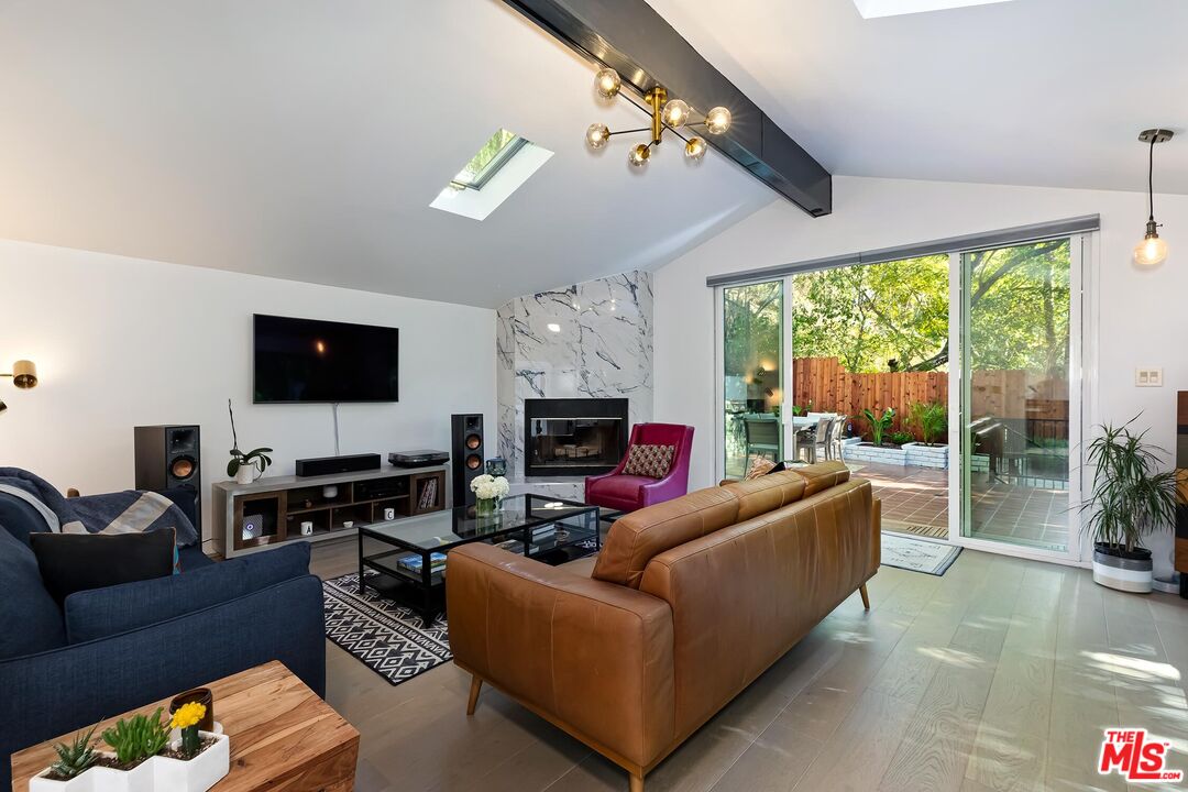 4221 Vanetta Drive Studio City, CA 91604 - Photo 2 of 41 a living room with furniture a flat screen tv and a large window