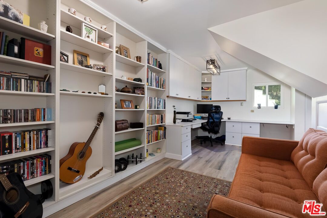 4221 Vanetta Drive Studio City, CA 91604 - Photo 32 of 41 a living room with furniture and a book shelf