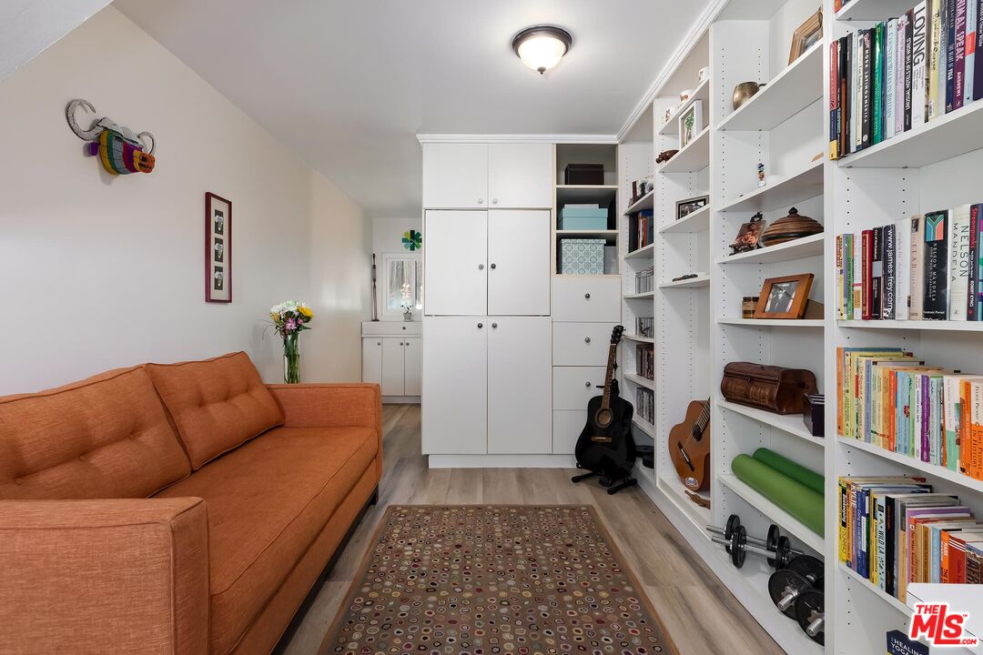 4221 Vanetta Drive Studio City, CA 91604 - Photo 33 of 41 a living room with furniture and a book shelf
