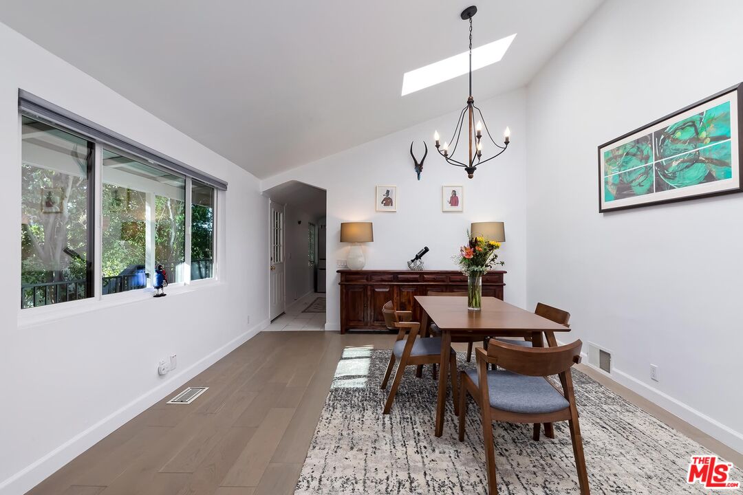 4221 Vanetta Drive Studio City, CA 91604 - Photo 7 of 41 a view of a dining room with furniture window and wooden floor