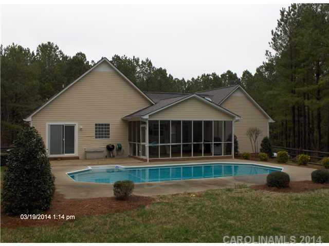 1607 Stack Road Monroe, NC 28112 - Photo 7 of 8 a front view of a house with garden