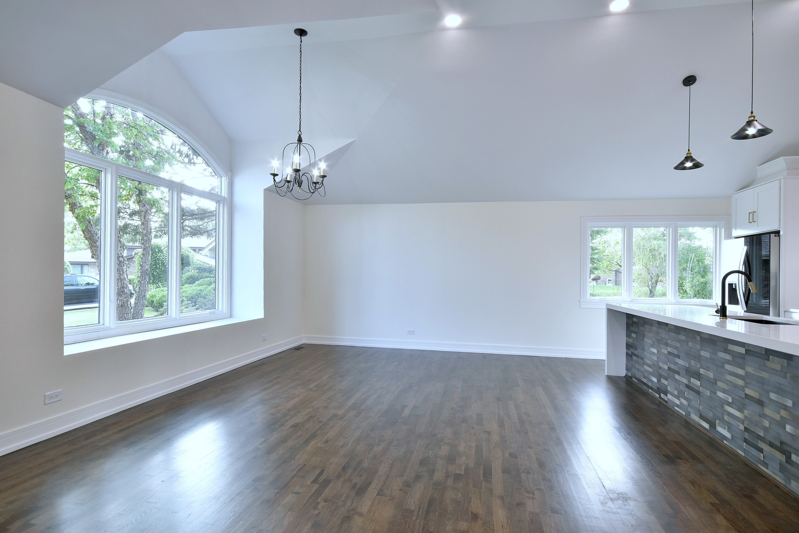 7609 Baker Court Darien, IL 60561 - Photo 14 of 39 a view of a room with wooden floor fan and windows