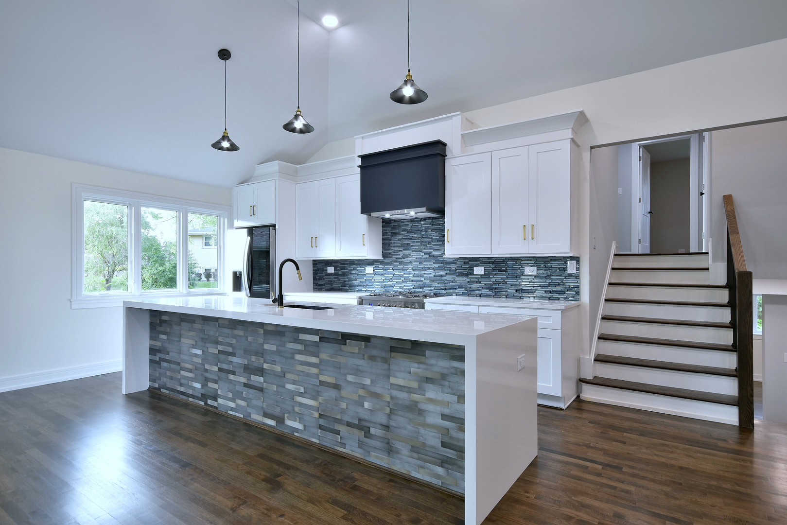 7609 Baker Court Darien, IL 60561 - Photo 15 of 39 a large kitchen with stainless steel appliances granite countertop a stove and a wooden floors