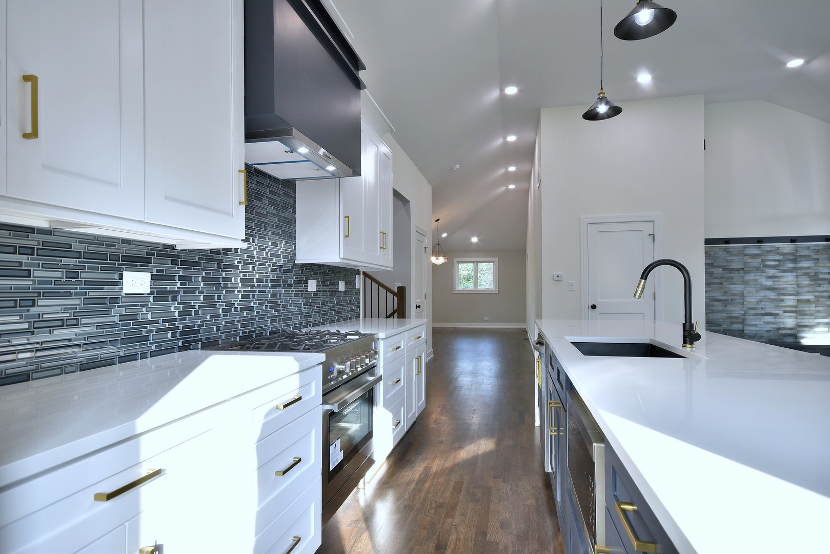 7609 Baker Court Darien, IL 60561 - Photo 18 of 39 a kitchen with stainless steel appliances a sink stove and refrigerator