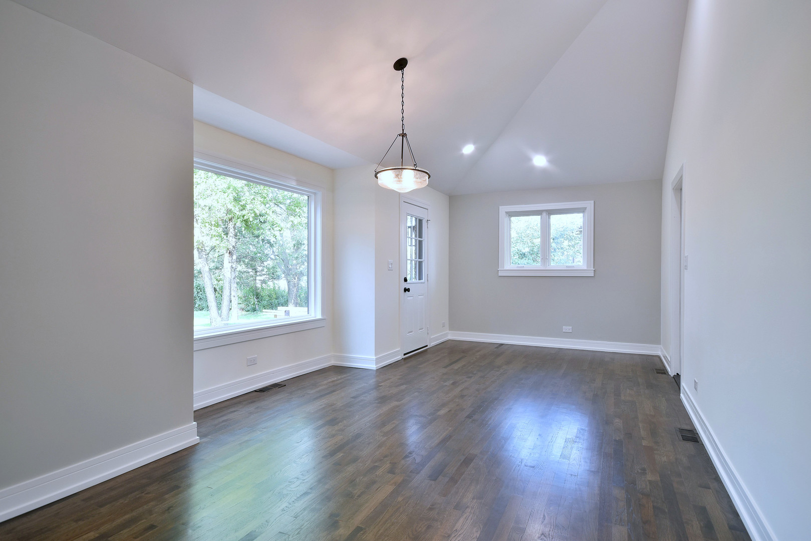 7609 Baker Court Darien, IL 60561 - Photo 22 of 39 wooden floor in an empty room with a window