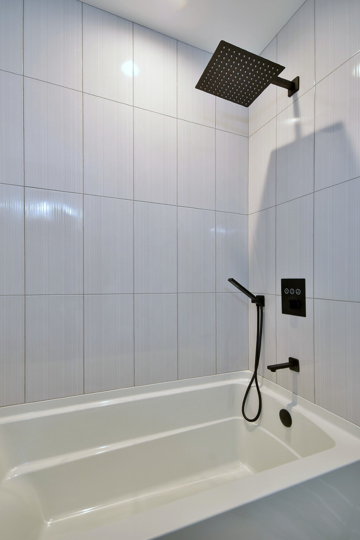 7609 Baker Court Darien, IL 60561 - Photo 24 of 39 a bathroom with a shower