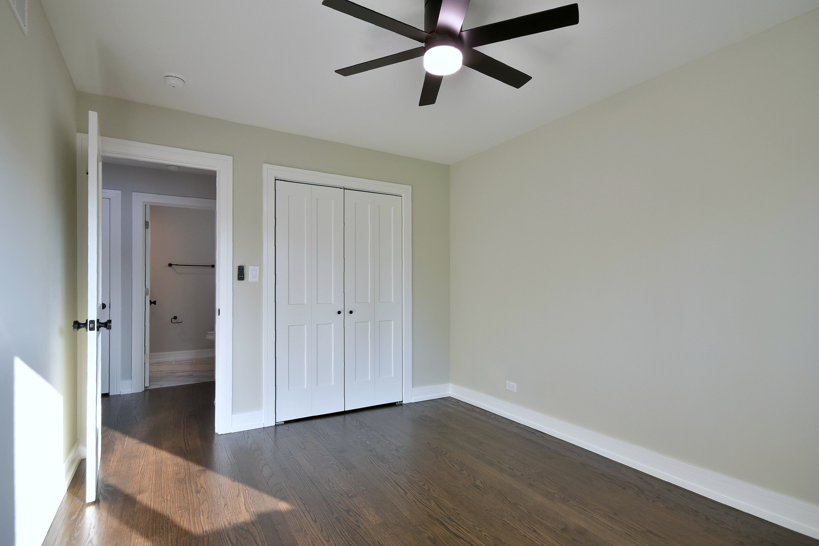 7609 Baker Court Darien, IL 60561 - Photo 25 of 39 an empty room with wooden floor and windows