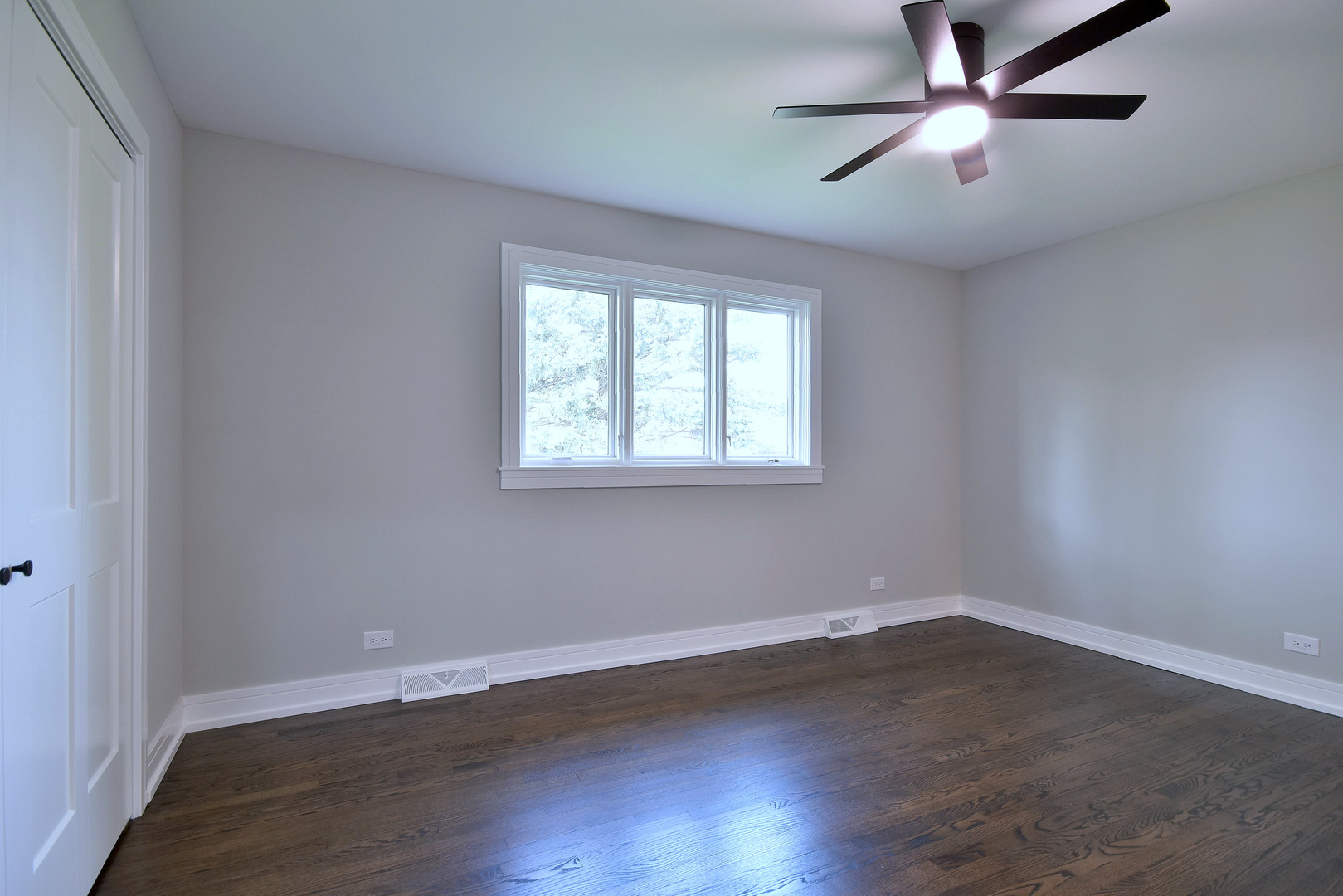 7609 Baker Court Darien, IL 60561 - Photo 27 of 39 wooden floor in an empty room with a window