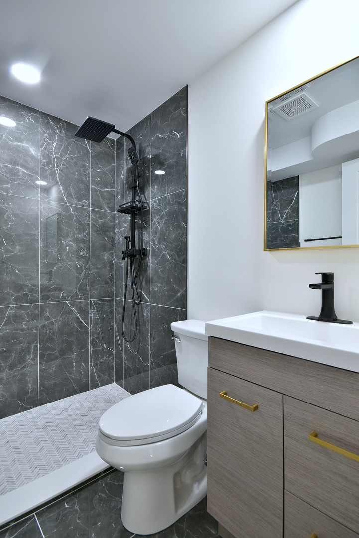7609 Baker Court Darien, IL 60561 - Photo 30 of 39 a bathroom with a sink toilet and shower