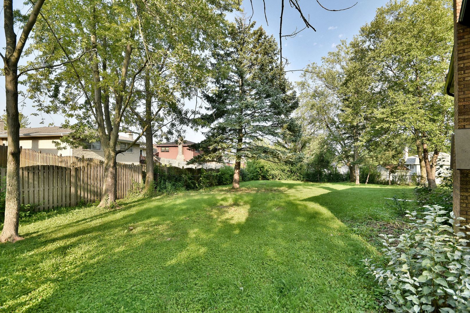 7609 Baker Court Darien, IL 60561 - Photo 3 of 39 a view of a garden with a tree