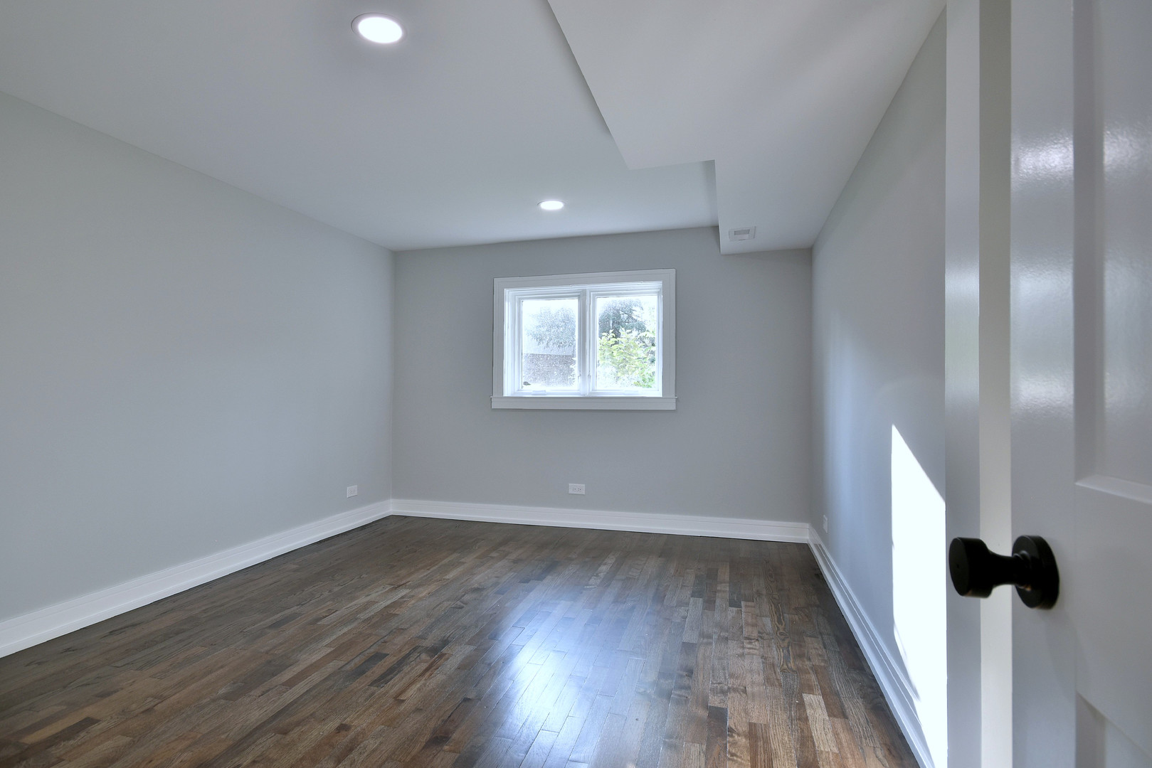 7609 Baker Court Darien, IL 60561 - Photo 32 of 39 wooden floor in an empty room with a window