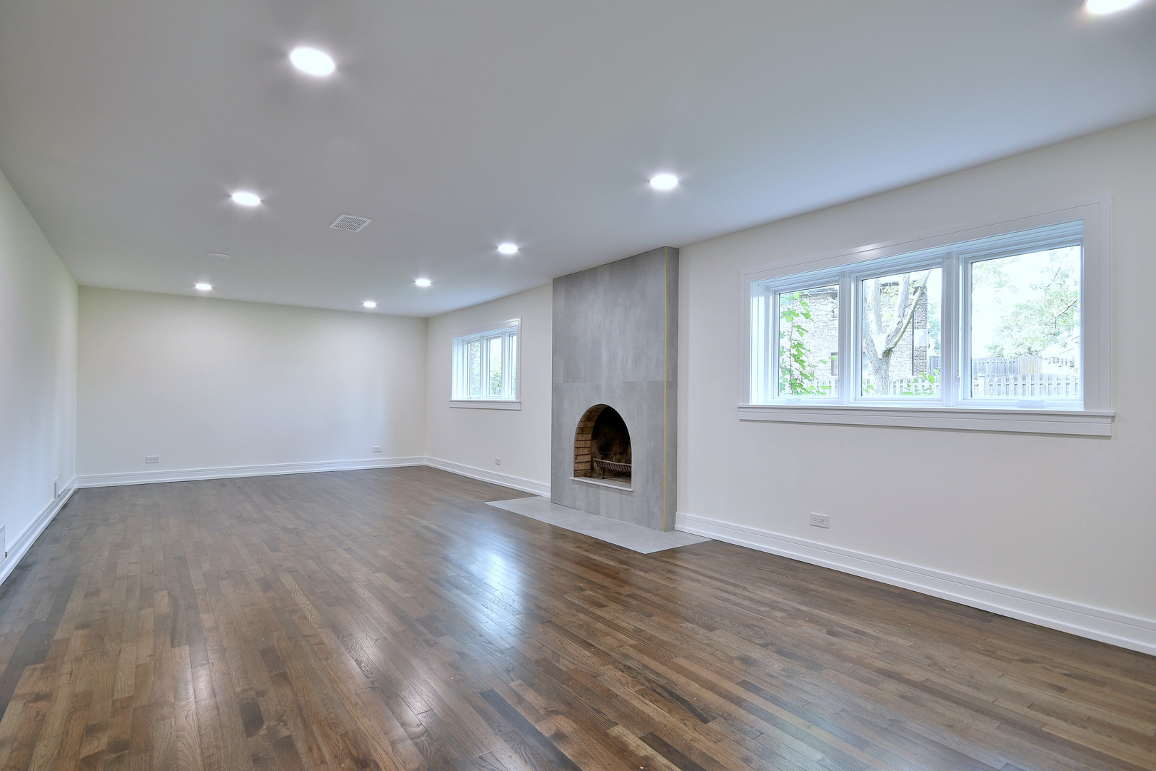 7609 Baker Court Darien, IL 60561 - Photo 35 of 39 a view of empty room with wooden floor and fan