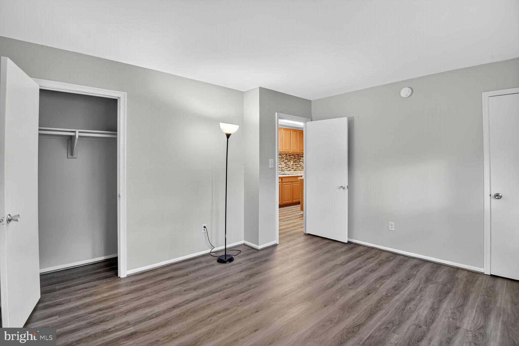 7505 Riverdale Road, Unit 2039 Hyattsville, MD 20784 - Photo 12 of 15 an empty room with wooden floor & closet area