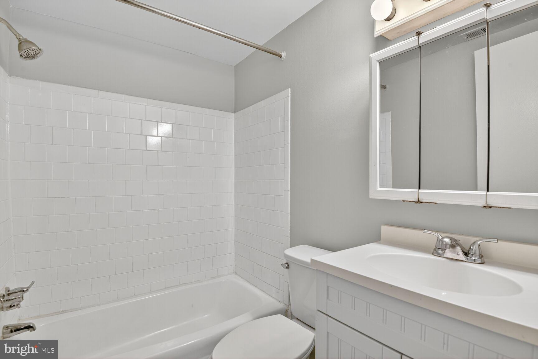 7505 Riverdale Road, Unit 2039 Hyattsville, MD 20784 - Photo 14 of 15 a bathroom with a sink and a mirror