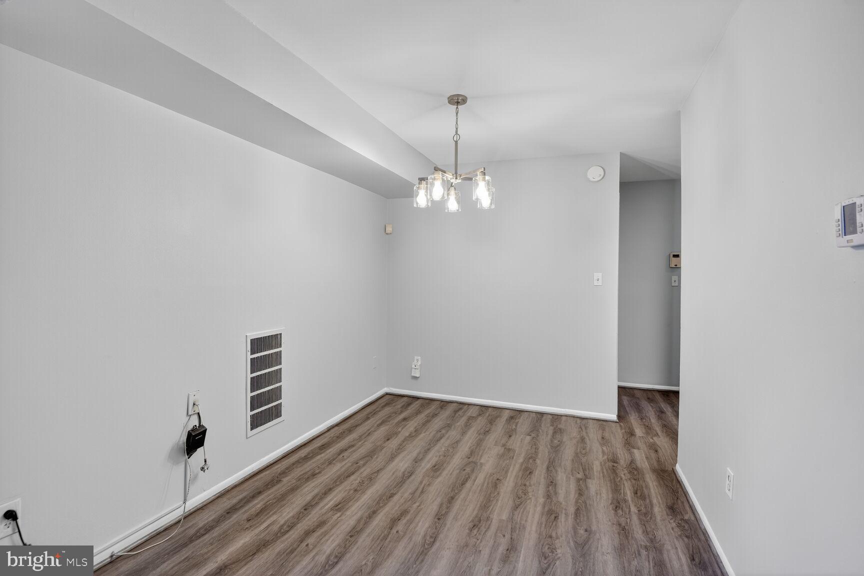 7505 Riverdale Road, Unit 2039 Hyattsville, MD 20784 - Photo 6 of 15 a view of a room with wooden floor
