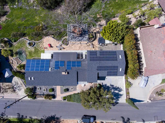 an aerial view of a house with a garden