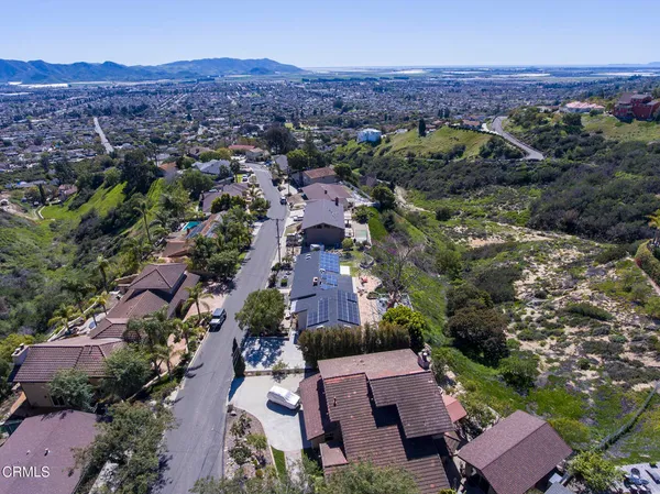 an aerial view of residential houses with outdoor space