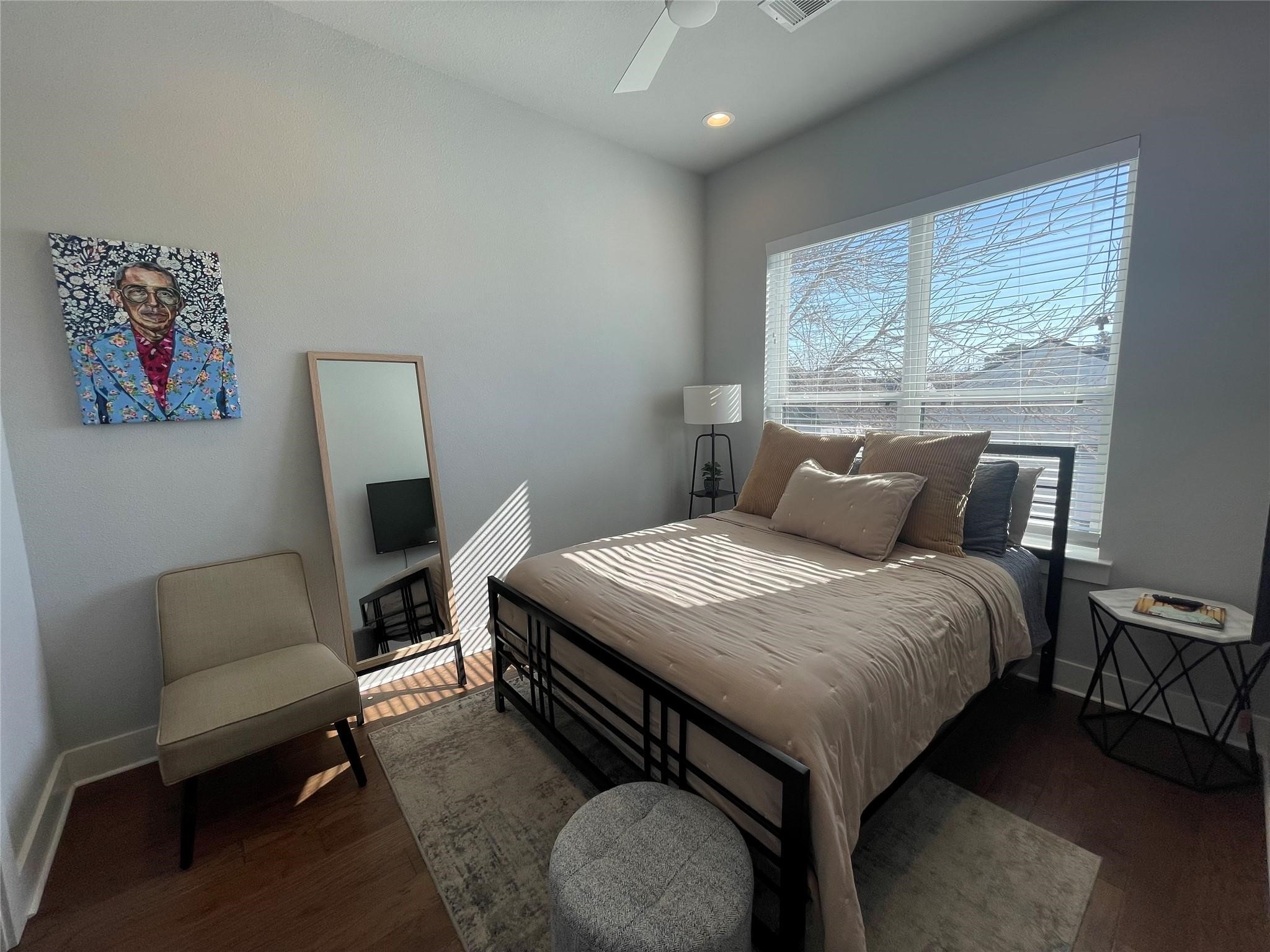902 Martin Street, Unit A Houston, TX 77018 - Photo 15 of 21 a bedroom with a bed a couch and a window