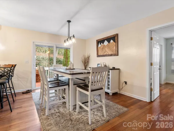 a dining room with furniture window wooden floor