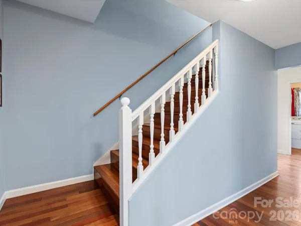 a view of an entryway with wooden floor
